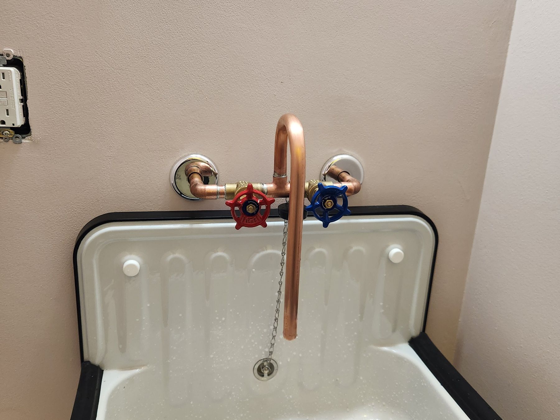 Copper supply lines feeding a utility sink