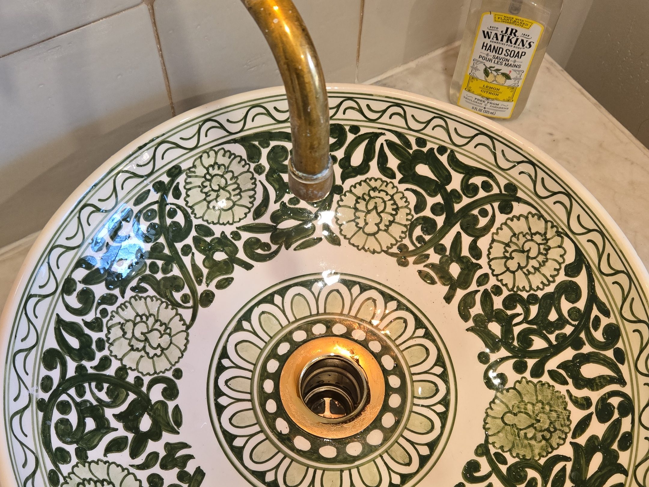 Decorative vessel sink with brass faucet fitted by Primrose