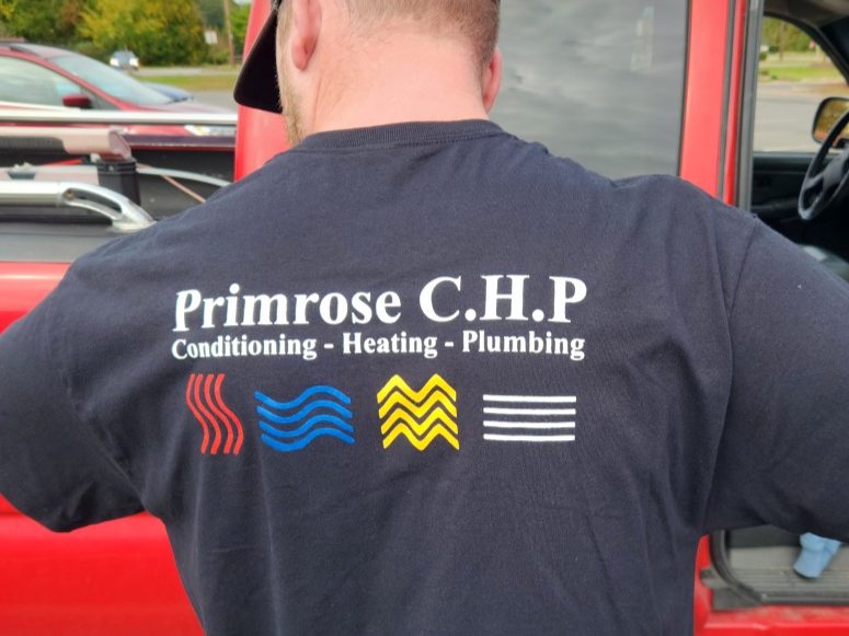 Primrose work shirt beside the service truck